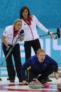 Sweden's skip and lead Margaretha Sigfridsson watches closely with Britain's Eve Muirhead and Anna Sloan keeping an eye on developmentsf